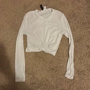 White long sleeve cropped top, size medium, cross detail in front
